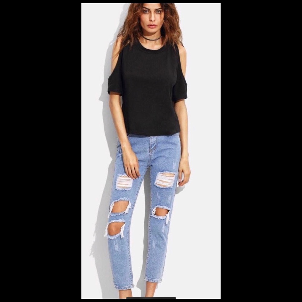 Ripped light wash blue jeans